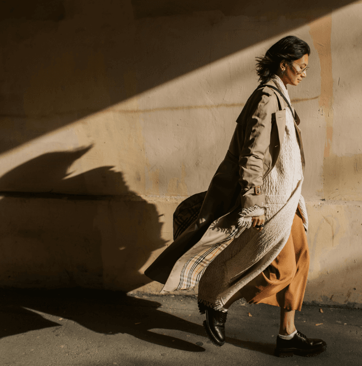 Walking along a sunlit wall
